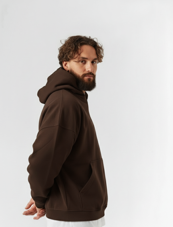 Brown oversized hoodie side profile with dropped shoulders